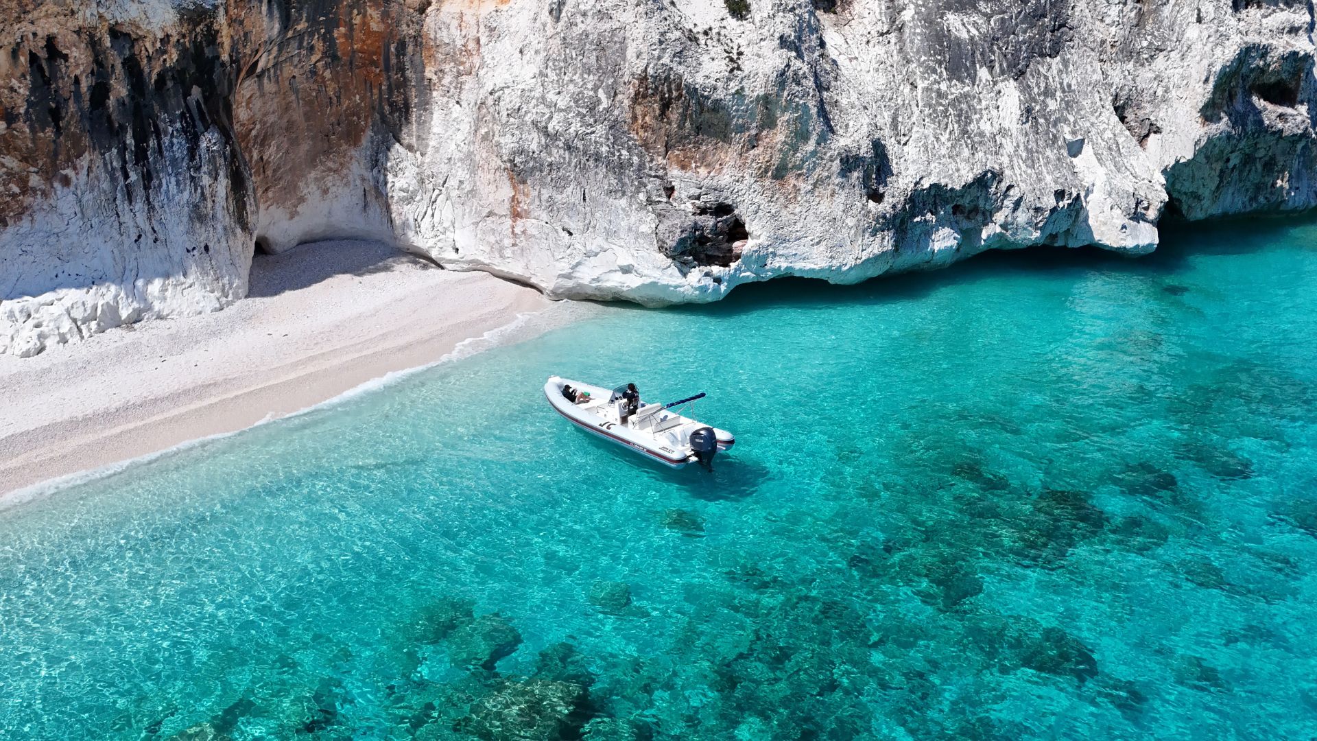 Dinghy at Cala delle Sorgenti on the coast of Baunei